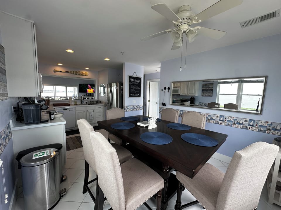 Water views galore. Enough space in the kitchen for all to enjoy.