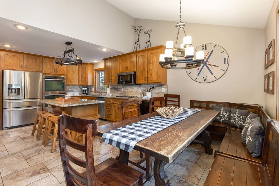 You'll love gathering around this rustic farmhouse table in your fully-equipped kitchen, perfect for memorable meals together.