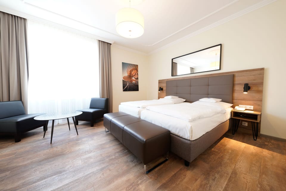 Deluxe Double Room | Minibar, in-room safe, individually decorated, individually furnished