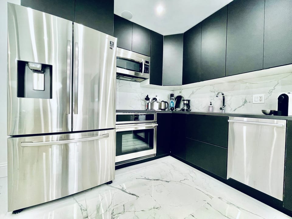 Modern kitchen with Induction Cooktop, Convection Oven, and stainless appliances