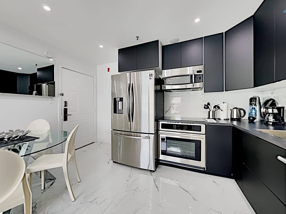 Discover the modern kitchen with top-of-the-line stainless steel appliances.