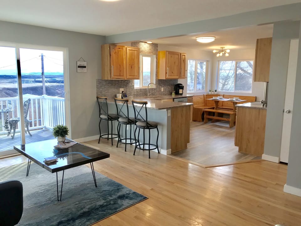 Welcome! Step inside the front door to the living room and into the kitchen 