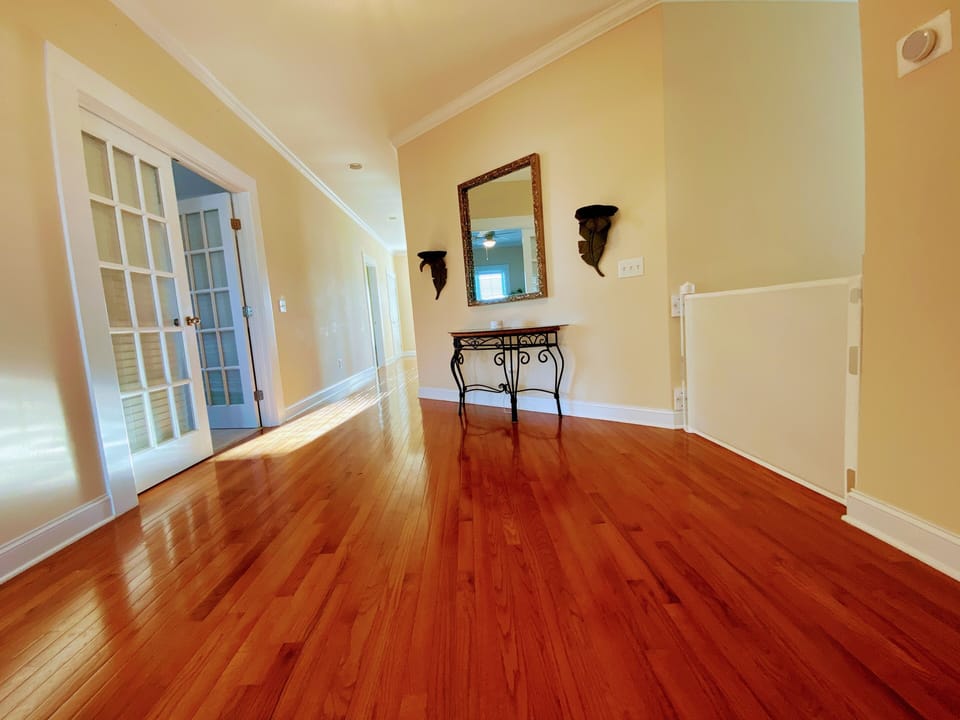 Upstairs hallway (both stairs have retractable gates)