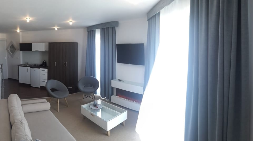 Deluxe Suite, 2 Bedrooms, Pool Access | Living room | 40-inch flat-screen TV with satellite channels, TV, heated floors
