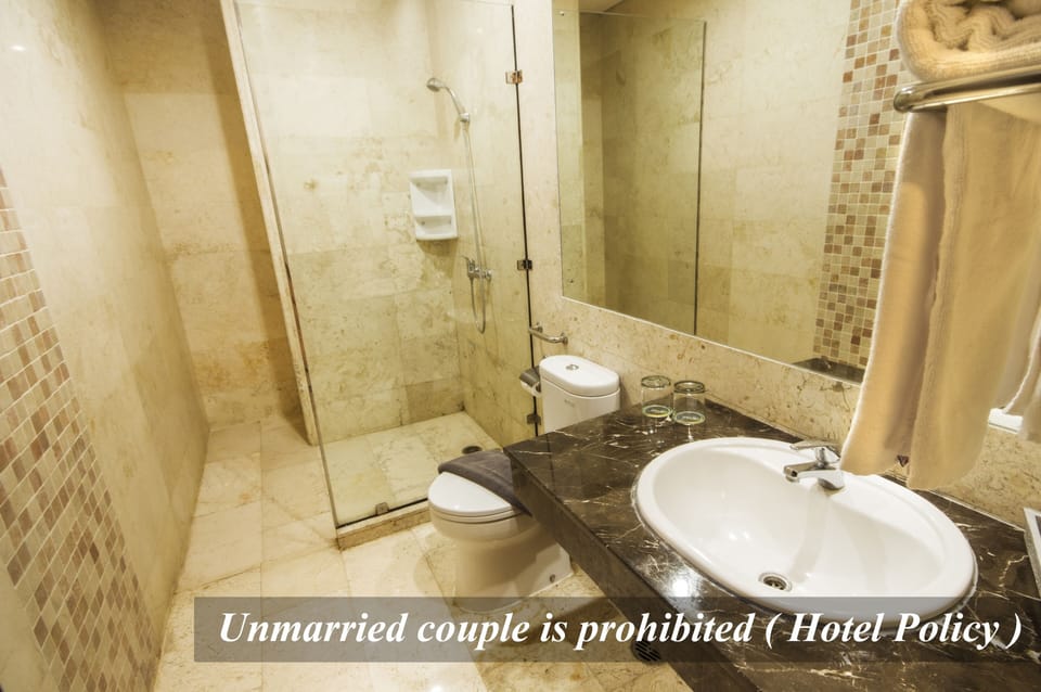 Twin Suite | Bathroom | Shower, rainfall showerhead, hair dryer, slippers