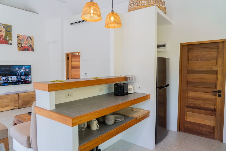 Comfort Villa | Private kitchen | Fridge, shared microwave, highchair, dining table