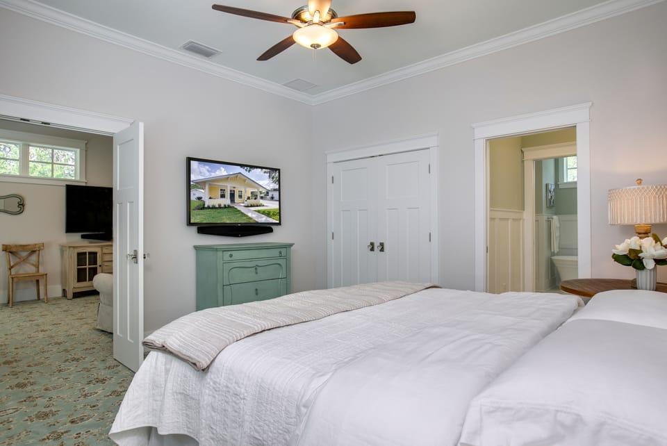 Over-sized Master bedroom with king bed that features a  memory foam mattress 