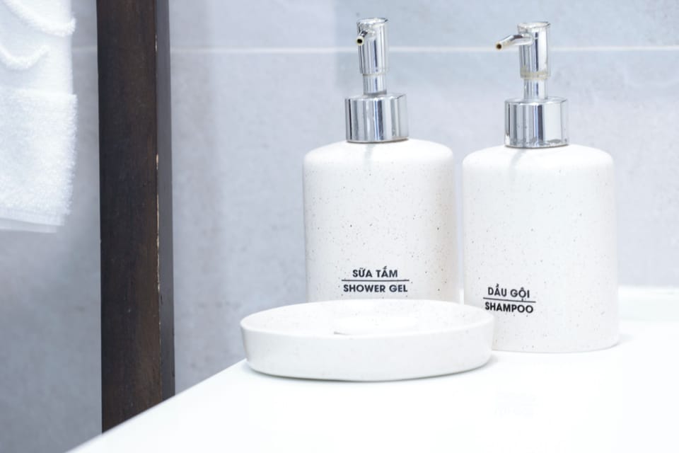 Deluxe Double Room, Pool View | Bathroom | Designer toiletries, hair dryer, bathrobes, slippers