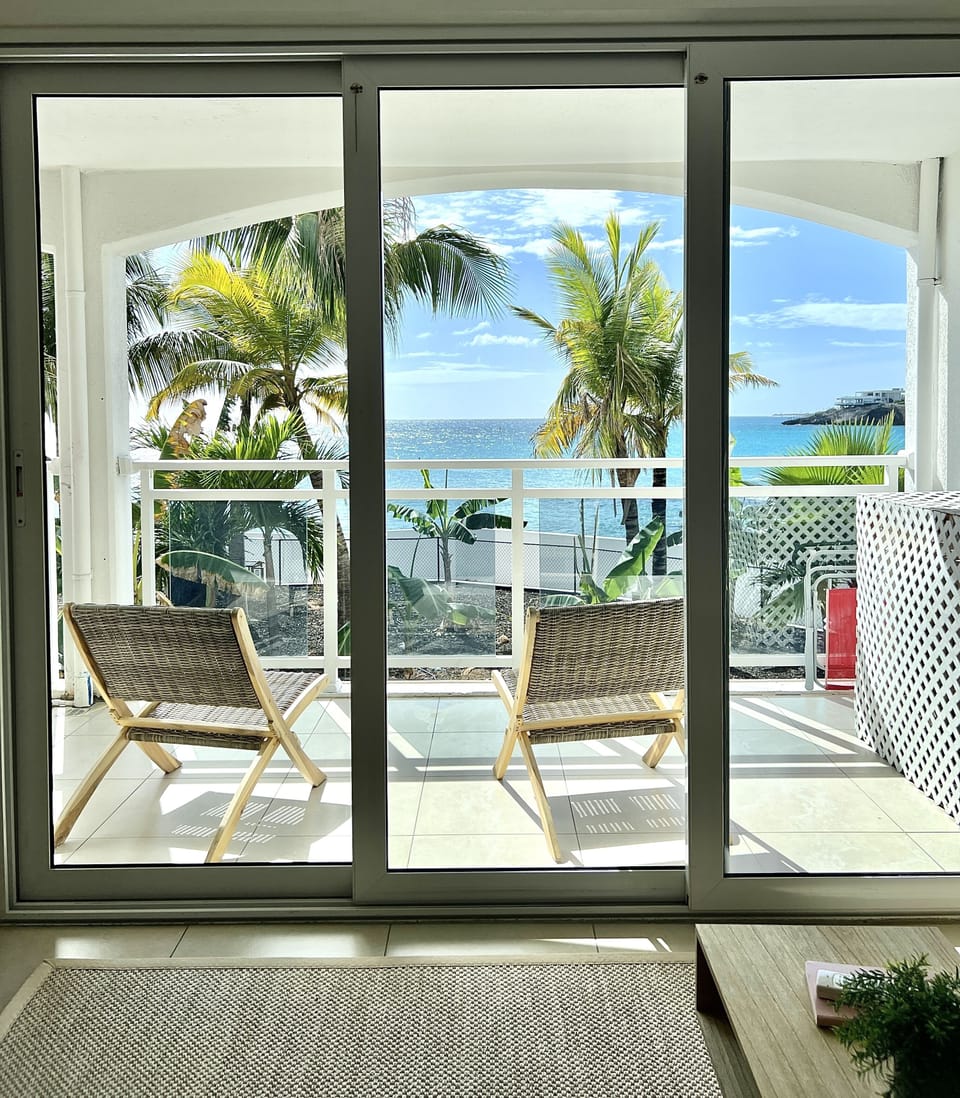 Balcony lounge chairs overlooking the Morgan animal sanctuary 