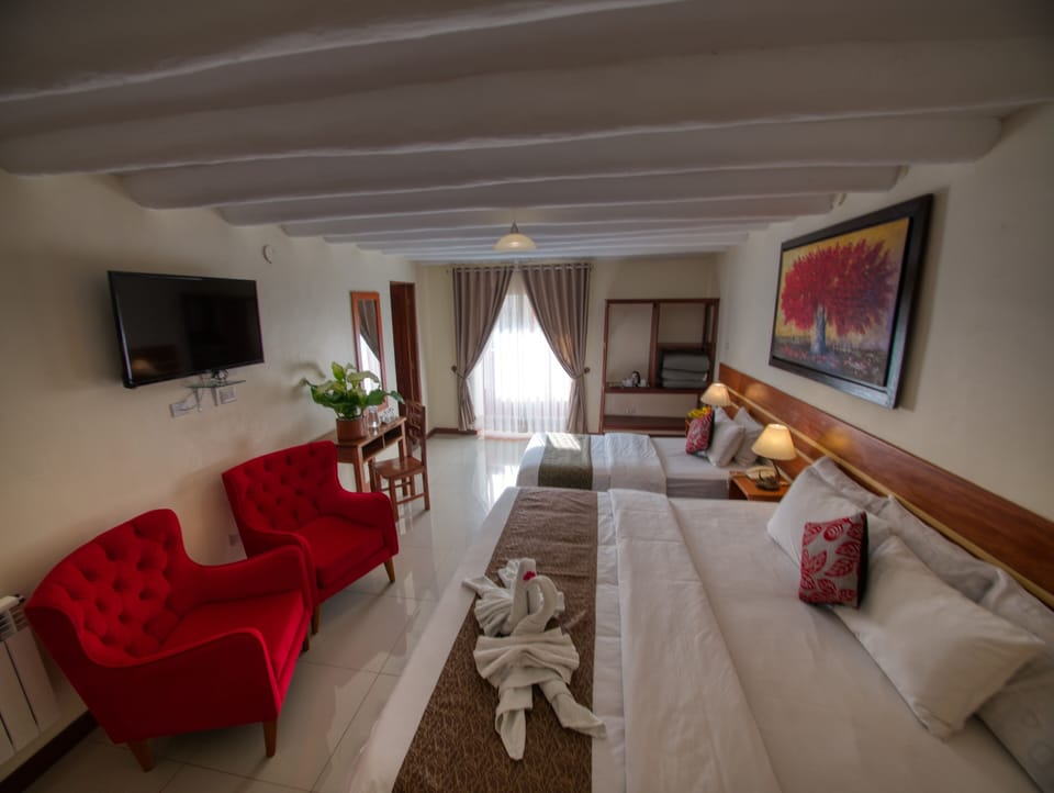 Deluxe Family Room With Balcony and Views | Desk, blackout drapes, WiFi (free), bed sheets
