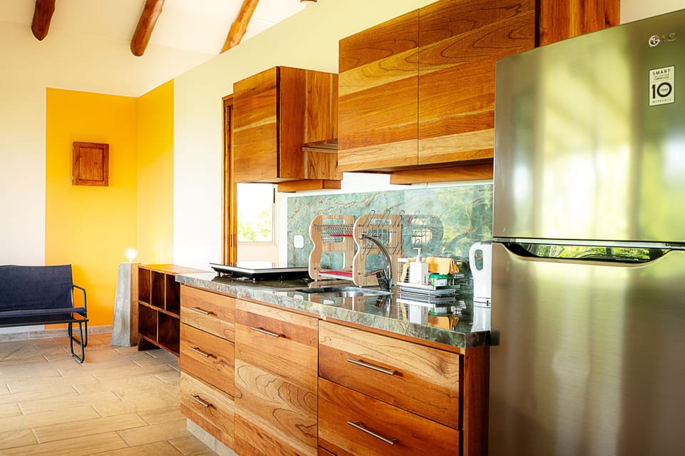 Exclusive Condo, 2 Bedrooms, Non Smoking, Ocean View | Private kitchen | Fridge, highchair