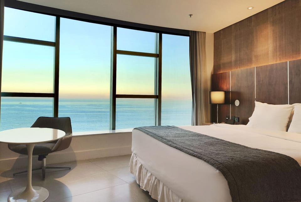 Deluxe Room, Sea View | Minibar, in-room safe, individually decorated, laptop workspace