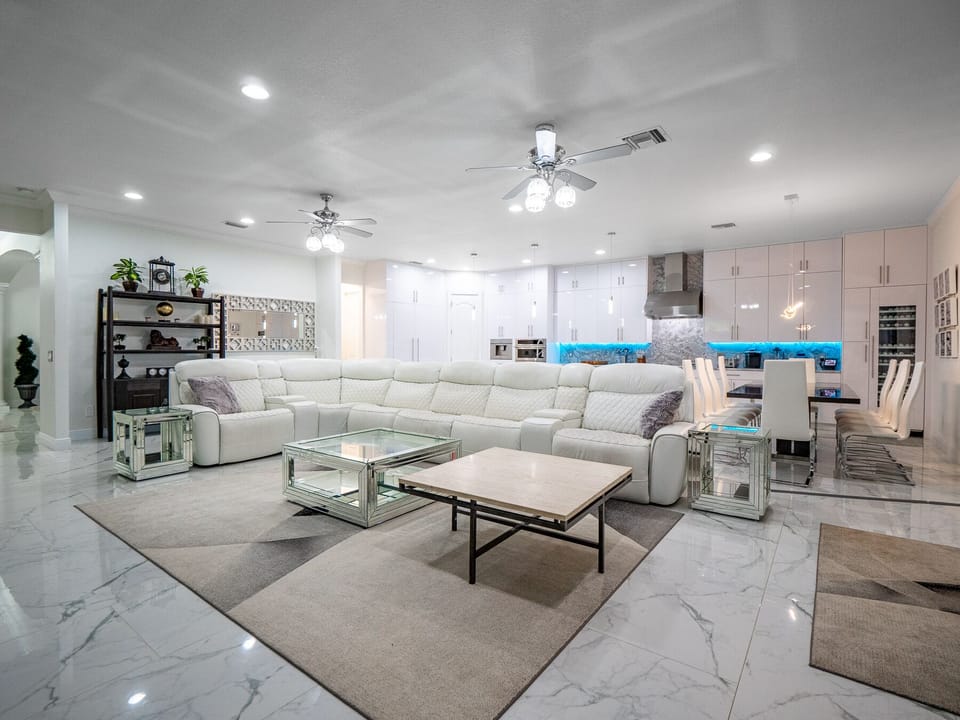 Brand new white leather reclining couches with seating for 11