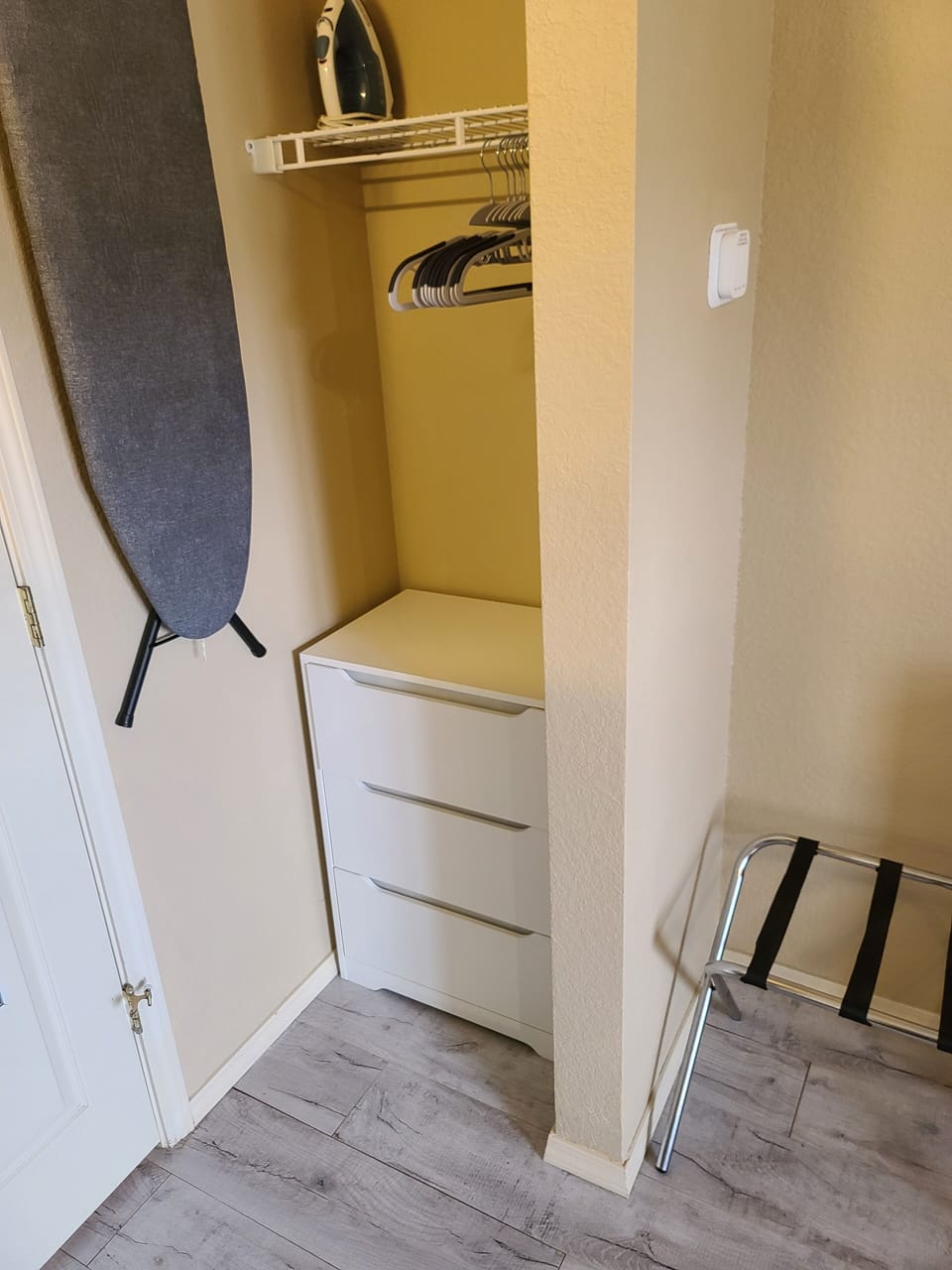 Iron and ironing board with three drawer chest