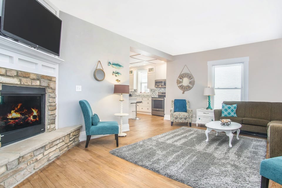 Living room with flat screen TV and fireplace