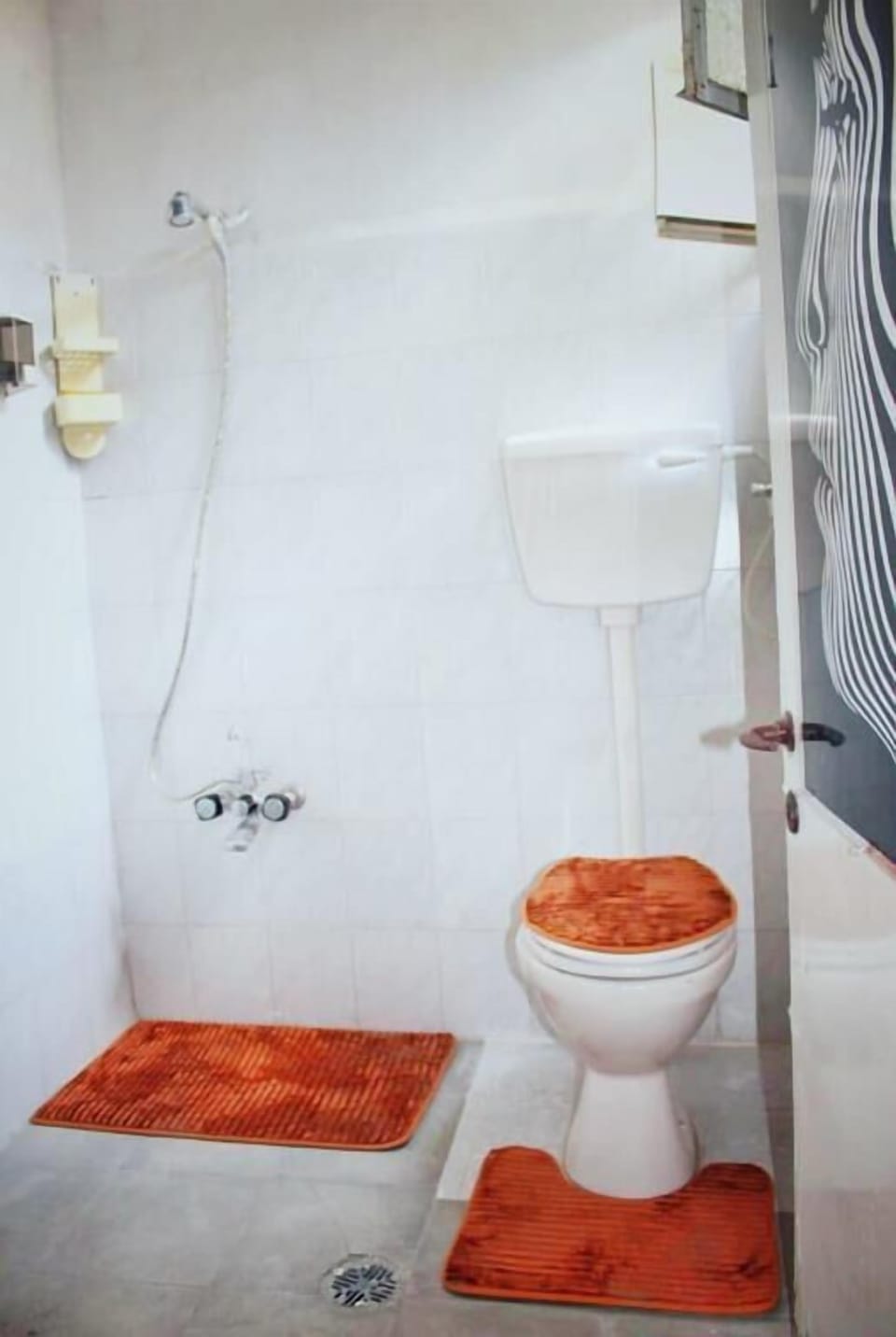 Shower, hair dryer, slippers, towels