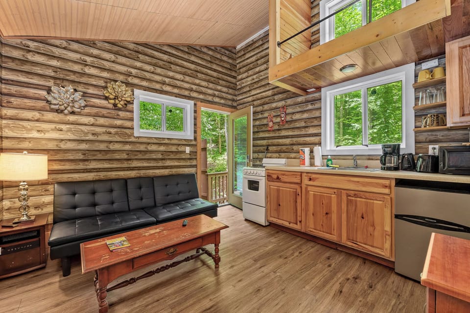 Unwind in style – Open-concept living with cozy seating & woodsy views