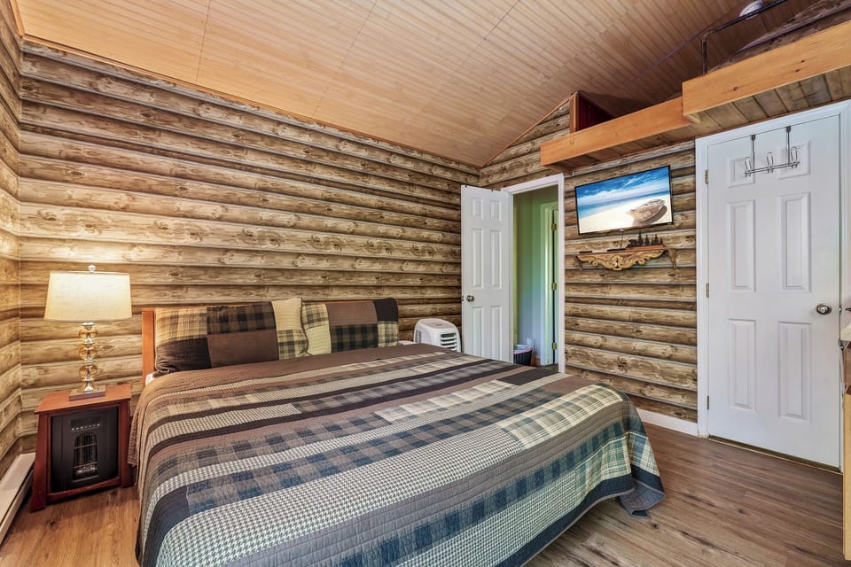 Wood beams and king bed make this the perfect retreat space