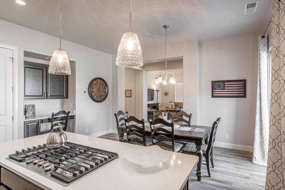 Kitchen Island & Dining Table - Share memories and stories while enjoying a family style meal around the Dining Table.