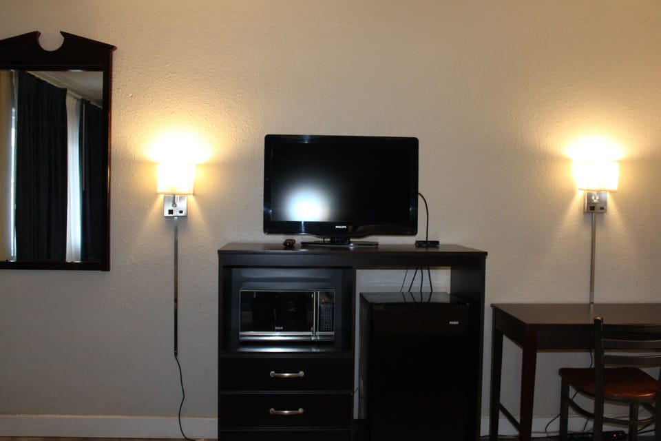 Desk, blackout drapes, iron/ironing board, rollaway beds