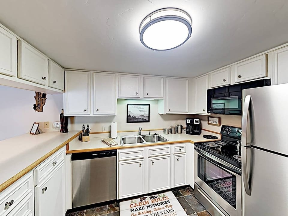 Kitchen. This spacious kitchen has stainless steel appliances.