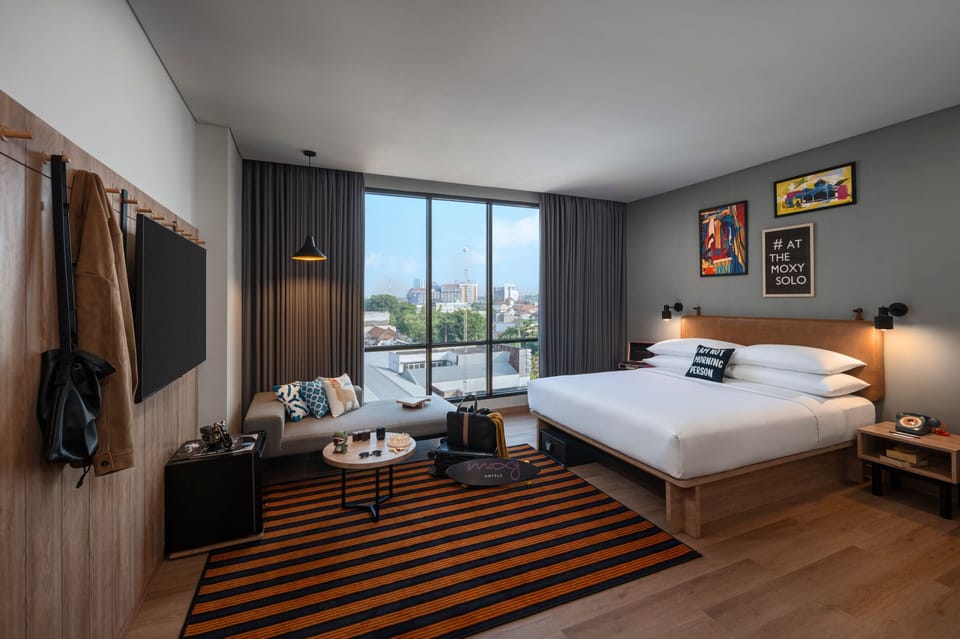 Deluxe Room, 1 Queen Bed, City View | Desk, laptop workspace, blackout drapes, soundproofing