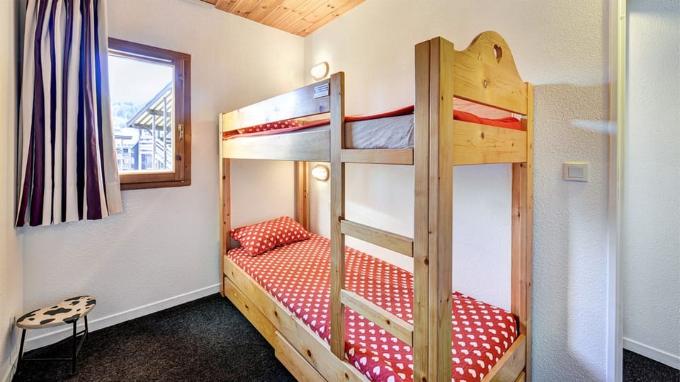 The sleeping alcove features a Bunk bed.