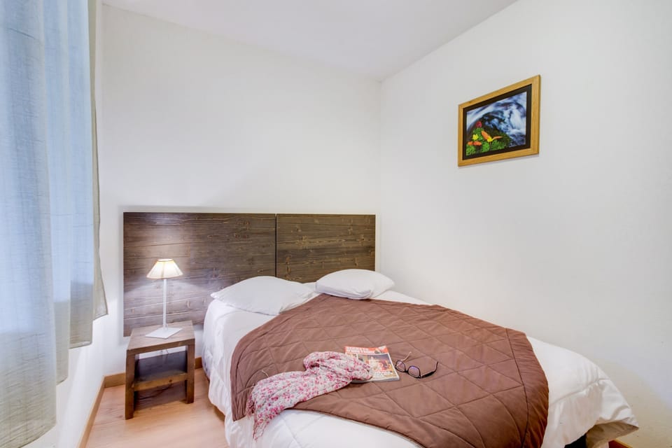 Relax on the comfy bed after a day outside.