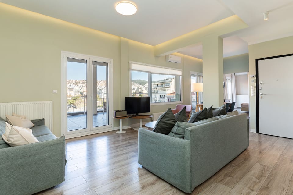 Luxury Penthouse, 2 Bedrooms, City View | Living area | 60-inch Smart TV with cable channels, TV, Netflix