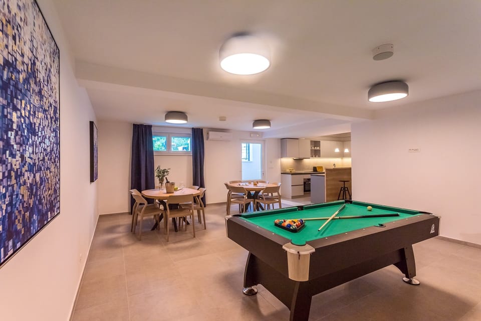 Fun Zone with a Pool table in a lower ground floor