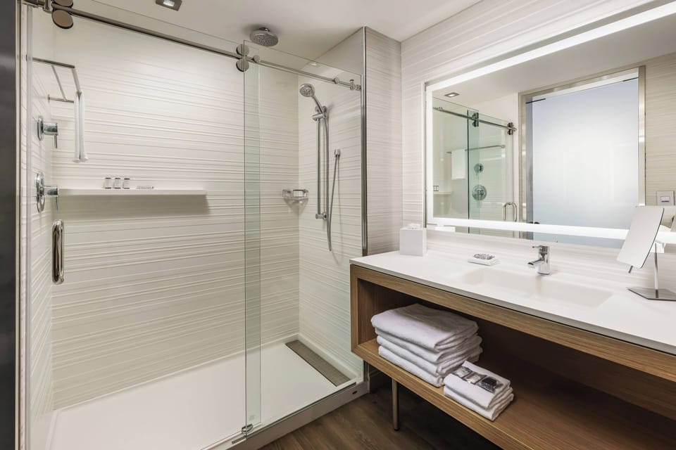 Designer toiletries, hair dryer, towels, soap