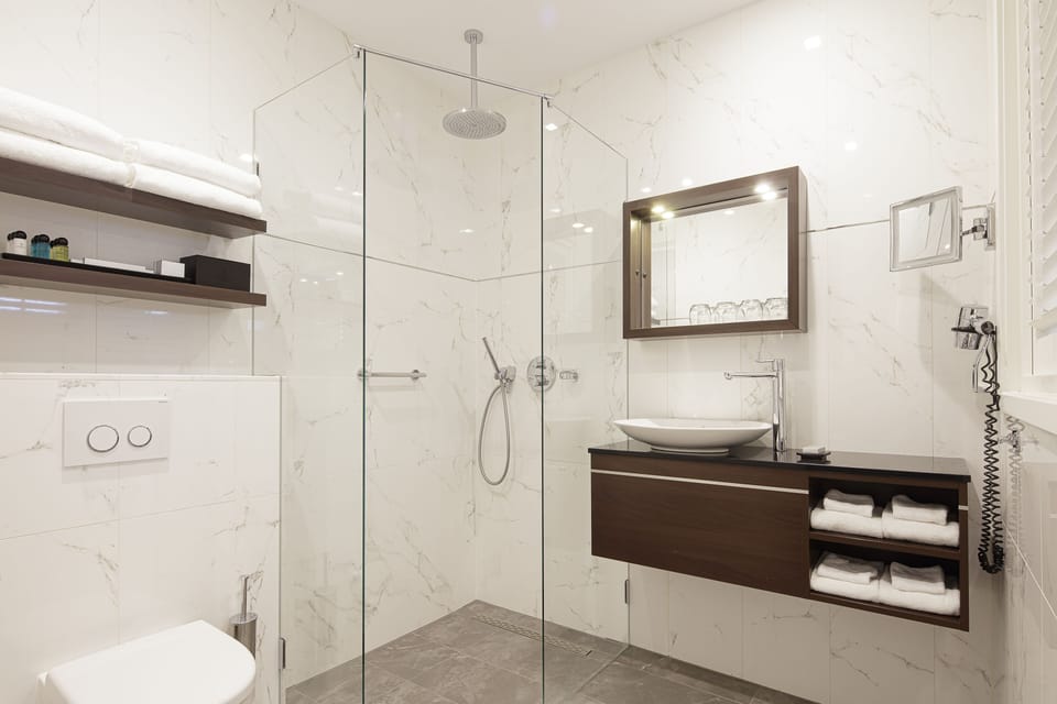 Combined shower/tub, free toiletries, hair dryer, slippers