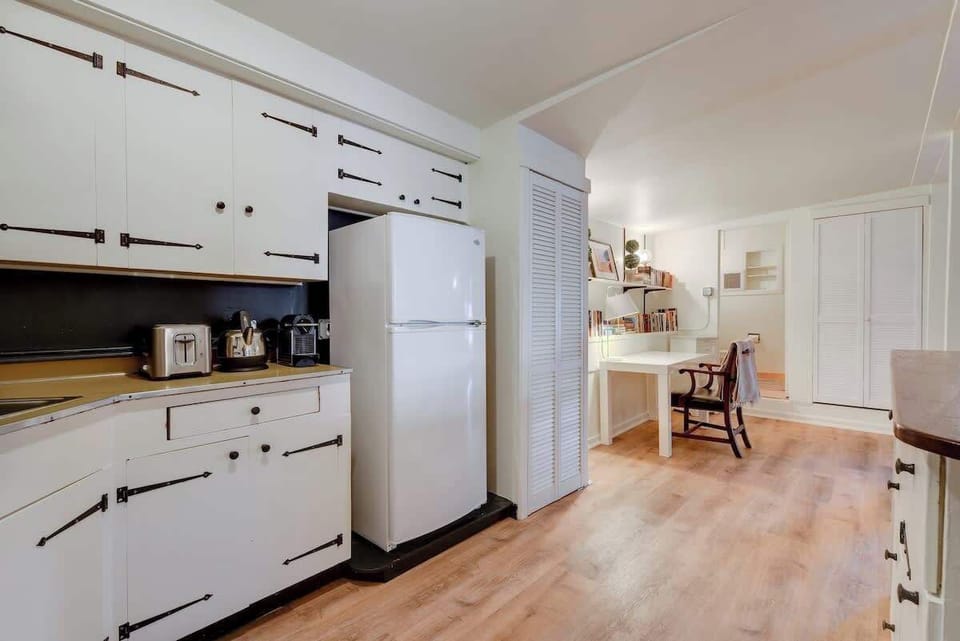 Cozy kitchen featuring a full stove, plenty of storage, and a clean, functional layout.