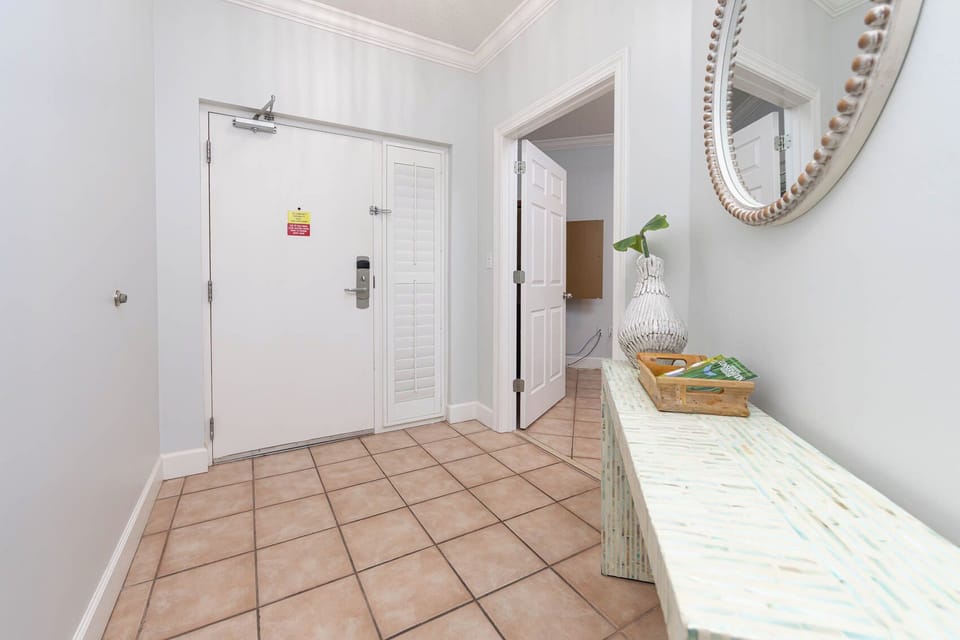 Step into this welcoming entrance, where coastal decor sets a relaxing tone for your getaway