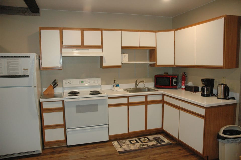 Kitchen with modern appliances including a newly added dishwasher and all the amenities you need to prepare and enjoy meals.