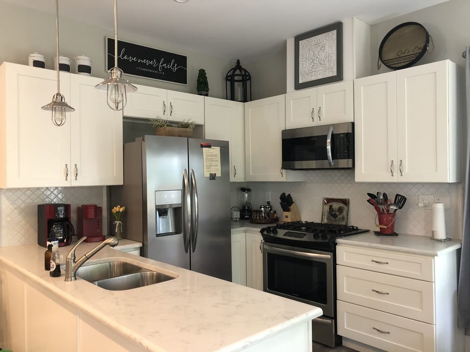 Full kitchen with gas stove, dishwasher, microwave, and full size refrigerator.
