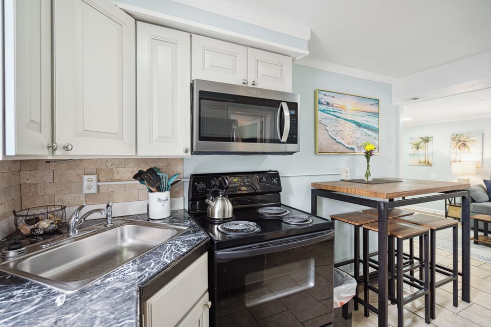 Kitchen is well appointed and fully equipped, minus a dishwasher.