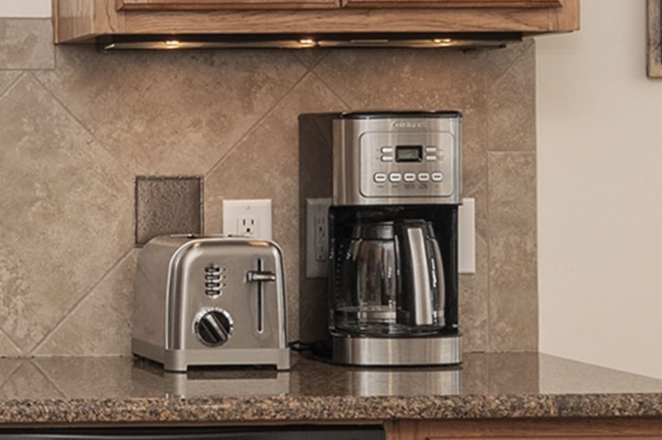 The home has a drip coffee maker and a toaster