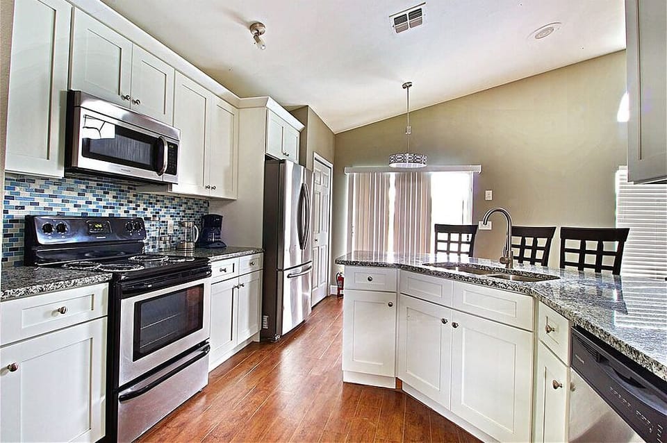 Kitchen with brand new porcelain wood plank flooring