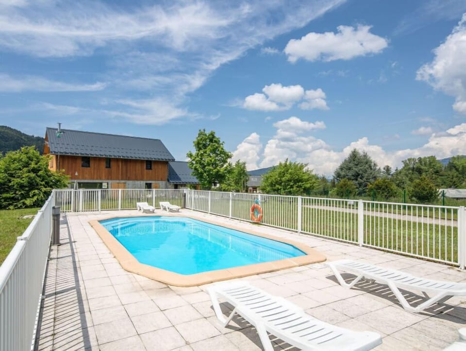 Take in gorgeous views while lounging around the on-site outdoor pool.