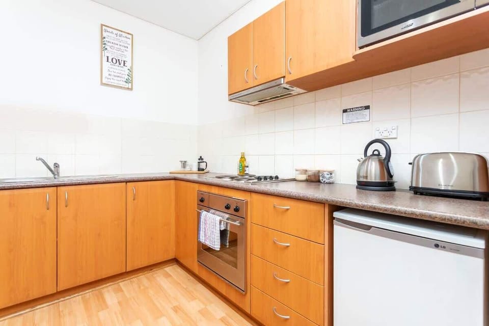 Kitchen - Crockery & cutlery provided along with basic kitchen amenities.