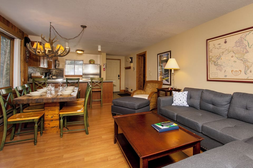 Sink into the plush sectional sofa and plan your adventures while enjoying the open-concept design connecting living and dining areas.