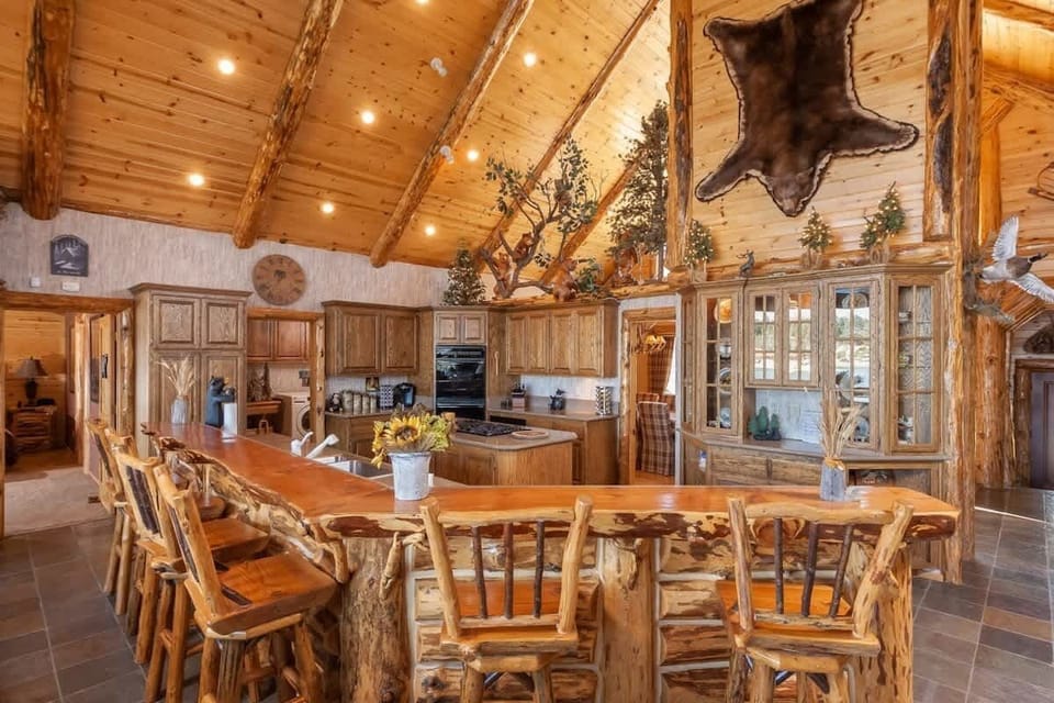 Long Breakfast Bar facing fully stocked granite kitchen.