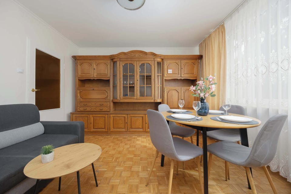 A wider perspective of the living area, highlighting the open and bright layout.