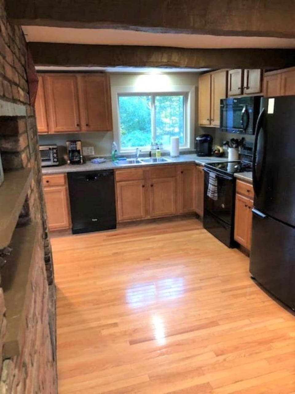 Kitchen with convenient appliances and staples 