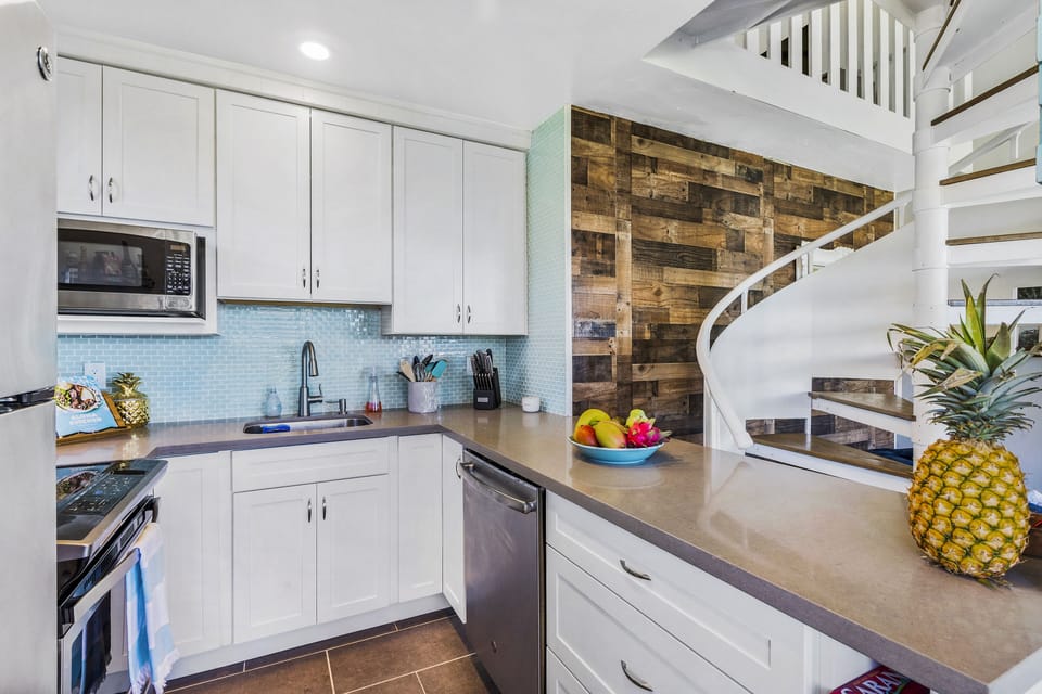 Fully equipped kitchen has modern appliances, ample counter space and essentials