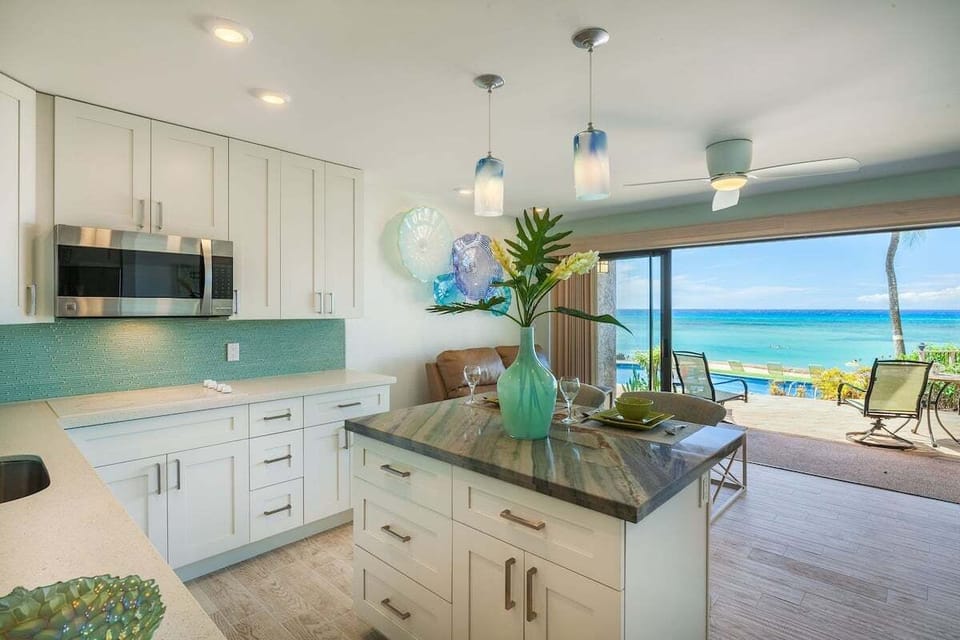 Fully equipped kitchen with open layout and breathtaking views of the sea