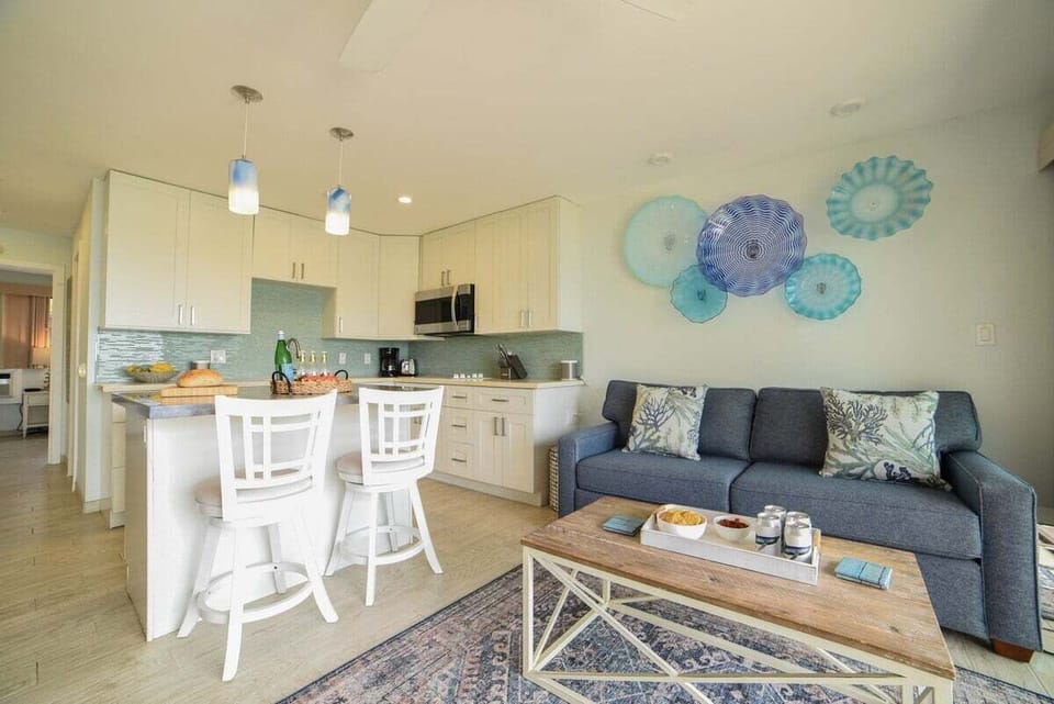 Comfortable lounge with chic design and easy access to kitchen and dining space