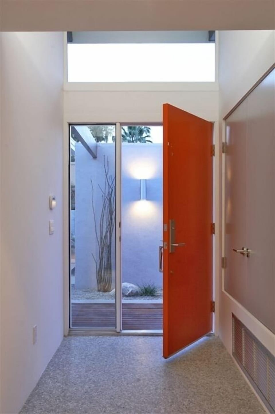 Entry with exposed concrete floors throughout