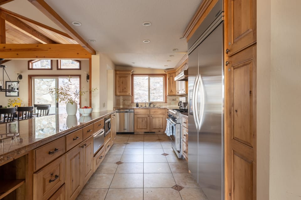 The kitchen features state of the art appliances.
